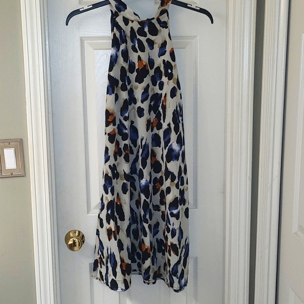 Cream and black with specks of blue and orange sleeveless dress
